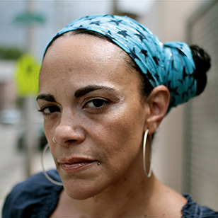 A headshot of Ursula Rucker.